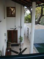 the swimming pool deck seen from the terrace looking down.